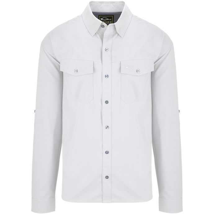 Traveler's Solid Dobby Shirt L/S: A white shirt with long sleeves, hidden button-down collar, and two chest pockets with button-through flaps. Classic fit, versatile for any season.