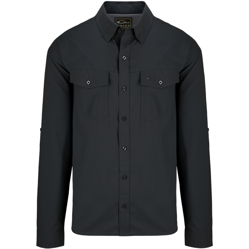 A black dobby textured shirt with hidden button-down collar, chest pockets, and split tail hem. Versatile and lightweight for all seasons.