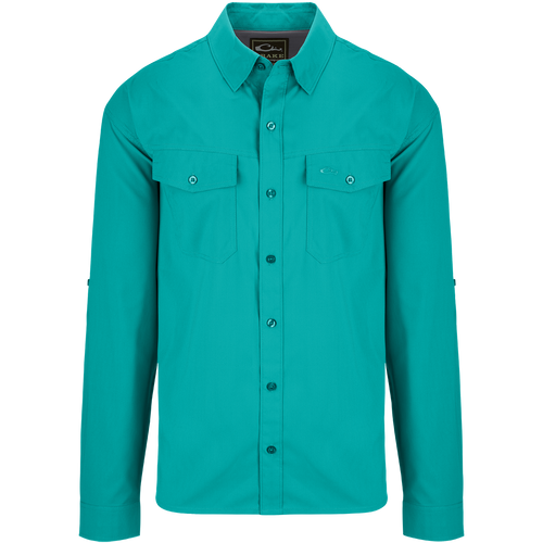 Traveler's Solid Dobby Shirt L/S: A classic fit long sleeve shirt with hidden button-down collar, chest pockets, and split tail hem. Made of featherweight polyester fabric with UPF30 sun protection. Versatile for any season.