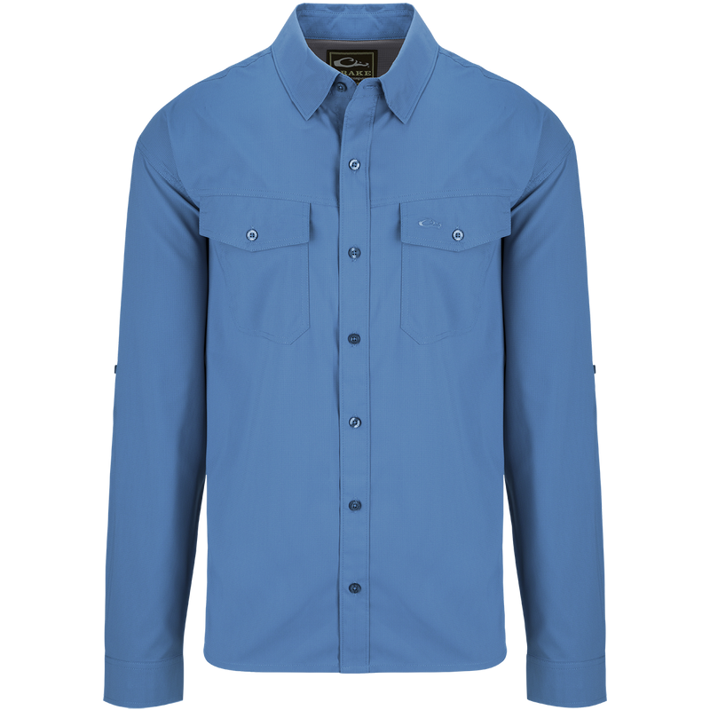 A blue dobby textured long sleeve shirt with hidden button-down collar, chest pockets, and split tail hem. Versatile for any season.