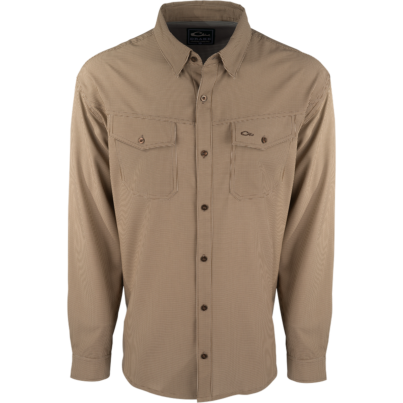 A lightweight, wrinkle-resistant Traveler's Check Shirt L/S with four-way stretch for freedom of movement. Moisture-wicking and breathable, perfect for the man on the go. Two chest pockets with button flaps.