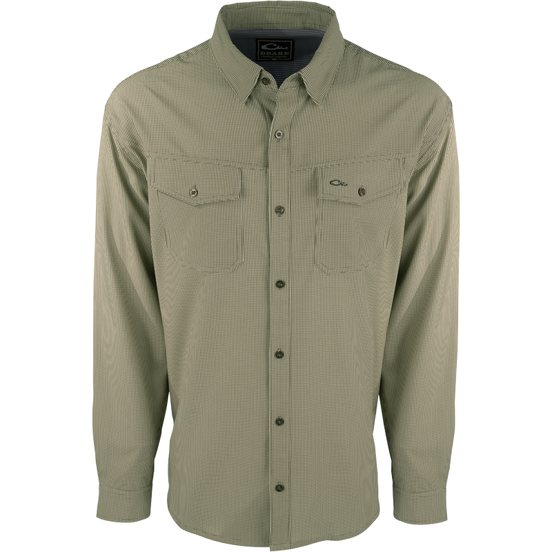 A lightweight, wrinkle-resistant Traveler's Check Shirt L/S with moisture-wicking fabric and two chest pockets with button flaps. Ideal for the man on the go, offering freedom of movement and ultimate comfort.