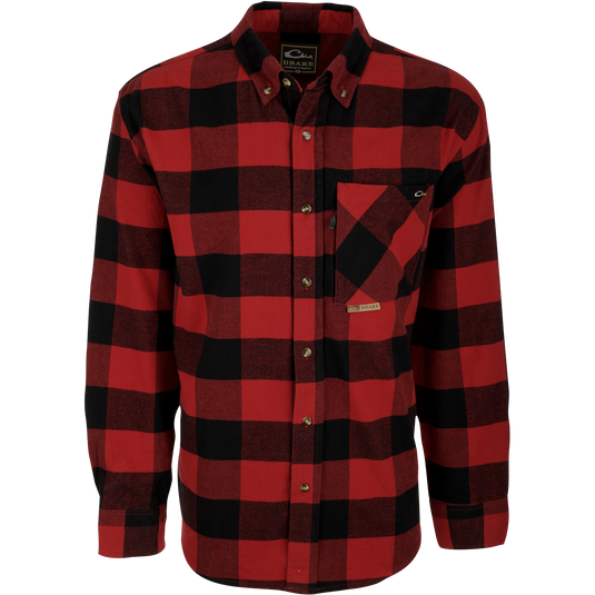 A close-up of the Autumn Brushed Twill Shirt, a red and black plaid shirt with a button-down collar and left chest pocket with hidden zippered pocket. Made from 100% brushed cotton twill. Perfect for fall and winter outdoor days.