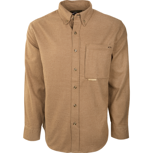 A brown and white checkered shirt made from 100% brushed cotton twill. Features a left chest pocket with a hidden zippered pocket behind, a seven-button front, and a button-down collar. Perfect for fall and winter outdoor activities.
