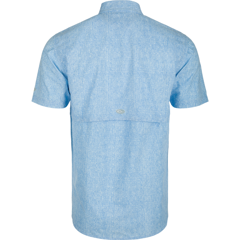 Heritage Heather Shirt S/S: A performance shirt made of 100% polyester micro mesh. Lightweight, moisture-wicking, and quick-drying. Features include a hidden button-down collar, vented cape back, and two chest pockets. Perfect for outdoor activities or office wear.
