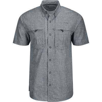 A grey Heritage Heather Shirt with pockets, made of 100% polyester micro mesh for natural cooling and quick drying. Features include a hidden button-down collar, vented cape back, and two front chest pockets. Perfect for performance and comfort in any setting.