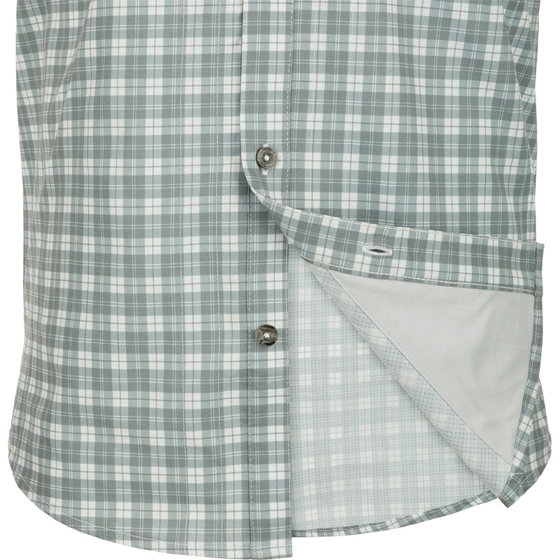 Hunter Creek Check Plaid Shirt S/S: A close-up of a lightweight, moisture-wicking shirt with a hidden button-down collar and two chest pockets.