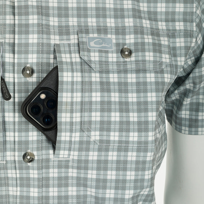 A close-up of the Hunter Creek Check Plaid Shirt S/S with hidden button-down collar, vented back cape, and two chest pockets.