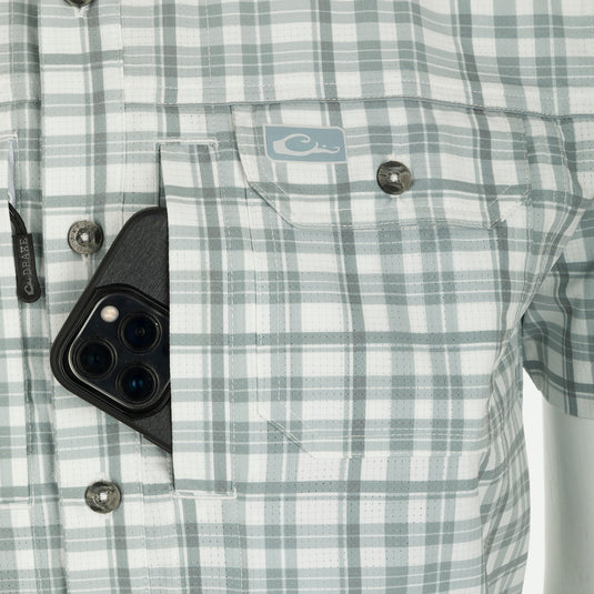 Hunter Creek Window Pane Plaid Shirt S/S: A close-up of a pocketed cell phone on a fabric background.
