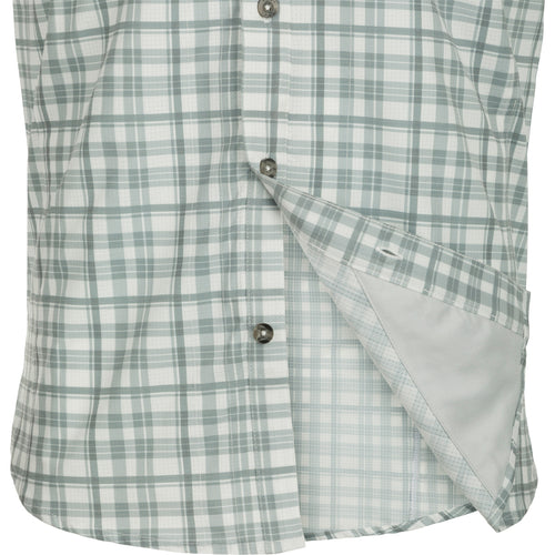Hunter Creek Window Pane Plaid Shirt S/S - A lightweight, moisture-wicking shirt made from micro-mesh polyester fabric. Features include a hidden button-down collar, vented back cape, and two chest pockets with zipper and Magnattach closures. Sculpted hem and built-in sunglass wipe add functionality.