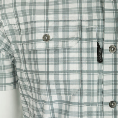 Hunter Creek Window Pane Plaid Shirt S/S - A close-up of a lightweight, moisture-wicking shirt with a hidden button-down collar, vented back cape, and two chest pockets.