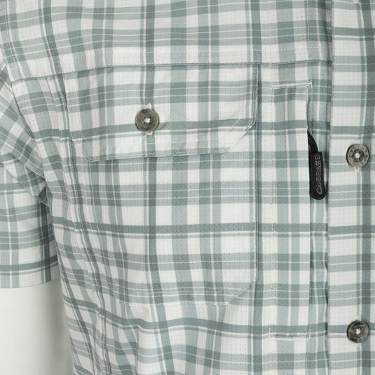 Hunter Creek Window Pane Plaid Shirt S/S - A close-up of a lightweight, moisture-wicking shirt with a hidden button-down collar, vented back cape, and two chest pockets.