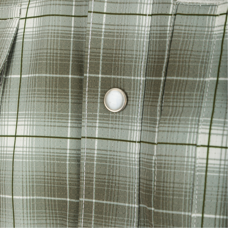 Cinco Ranch Plaid Long Sleeve Shirt with button on shirt and white round object on surface. Lightweight, breathable, UPF 30 sun protection, moisture-wicking, quick-drying. Hidden button-down collar, faux pearl snap buttons, adjustable roll-up sleeves.
