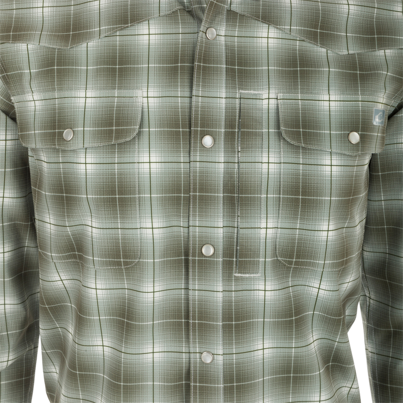 Cinco Ranch Plaid Long Sleeve Shirt - Close-up of shirt with button and plaid fabric pattern. Lightweight, breathable, and equipped with UPF 30 sun protection, moisture-wicking, and quick-drying capabilities. Hidden button-down collar and faux pearl snap buttons enhance the look. Adjustable roll-up sleeves and tab holders for any adventure.