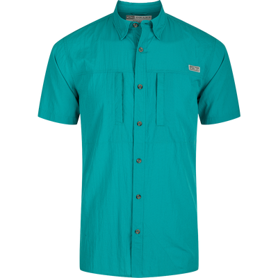 Classic Seersucker Minicheck Shirt: A close-up of a green shirt with buttons, featuring a hidden button-down collar and a zippered chest pocket.