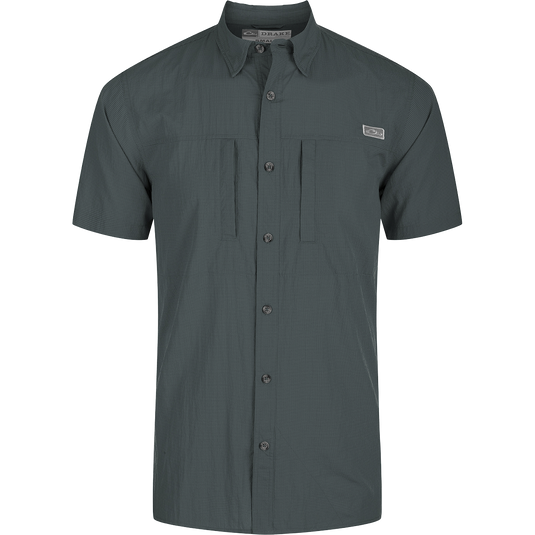 Classic Seersucker Minicheck Shirt: Close-up of a black shirt with a patch, button detail, and hidden zippered chest pocket.