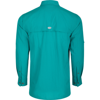 Classic Seersucker Minicheck Shirt L/S: A close-up of a blue shirt with a hidden zippered chest pocket and a Magnattach™ closure on the other pocket.