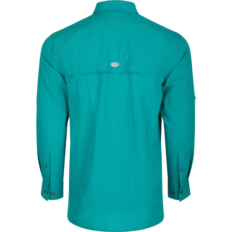Classic Seersucker Minicheck Shirt L/S: A close-up of a blue shirt with a hidden zippered chest pocket and a Magnattach™ closure on the other pocket.