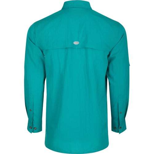 Classic Seersucker Minicheck Shirt L/S: A close-up of a blue shirt with a hidden zippered chest pocket and a Magnattach™ closure on the other pocket.