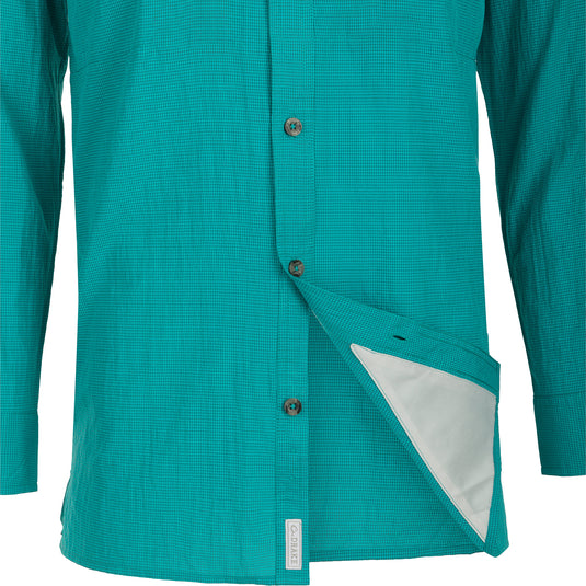 A close-up of the Drake Classic Seersucker Minicheck Shirt L/S, featuring a hidden button-down collar, zippered chest pocket, and Magnattach™ closure.
