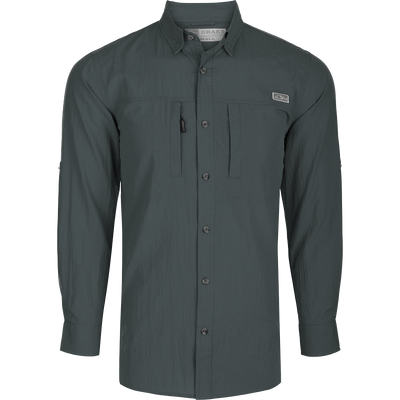 Classic Seersucker Minicheck Shirt L/S: A black long-sleeved shirt with buttons, featuring a hidden zippered chest pocket and a magnet closure on the other pocket. Made from a soft and featherweight performance fabric with UPF30 sun protection. Vented cape back and split tail hem for added ventilation and versatility. Perfect for hunting, fishing, and outdoor activities.