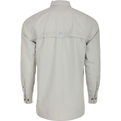 Close-up of the Drake Classic Seersucker Stripe Shirt, a soft and featherweight performance shirt with UPF30 sun protection, moisture-wicking fabric, and a hidden zippered chest pocket. Classic fit with a button-down collar and vented cape back. Perfect for hunting and outdoor activities.