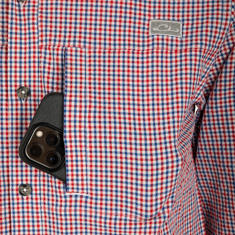 Classic Seersucker Grid Check Shirt L/S: A cell phone in a pocket of a shirt with hidden button-down collar, zippered chest pocket, and Magnattach™ closure.