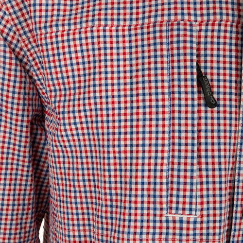 Classic Seersucker Grid Check Shirt L/S: A close-up of a black zipper on a red and blue checkered fabric shirt with hidden chest pockets and a button-down collar.