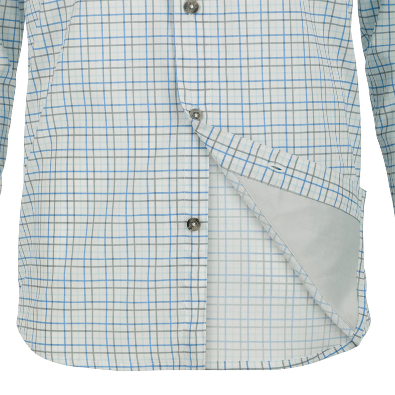 A classic fit Frat Tattersall Shirt with a hidden button-down collar, two chest pockets, and a vented cape back. Made from lightweight, moisture-wicking fabric with UPF30 sun protection. Sculpted hem allows for tucked or untucked wear. Perfect for hunting and outdoor activities.