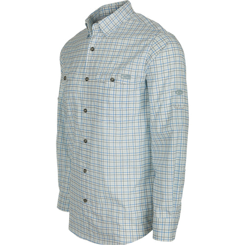 Frat Tattersall Shirt L/S: A lightweight, moisture-wicking shirt with a hidden button-down collar, chest pockets, and a vented cape back. Features UPF30 sun protection and a sculpted hem with a built-in sunglass wipe. Classic styling meets technical performance.