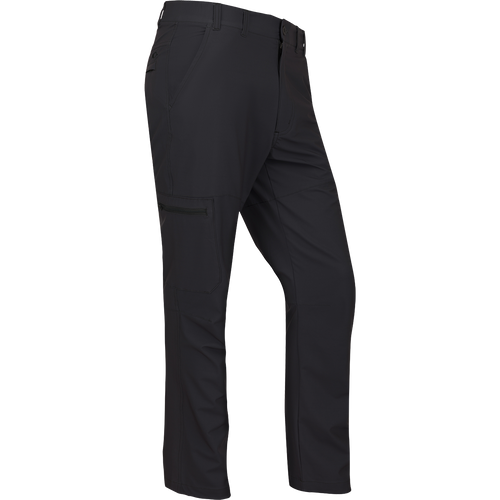 A rugged and sophisticated black Traveler Trek Pant with built-in stretch, moisture-wicking, and quick-drying features. Lightweight and comfortable, with articulated knees, front and back pockets, and a cargo pocket. Perfect for your next adventure.