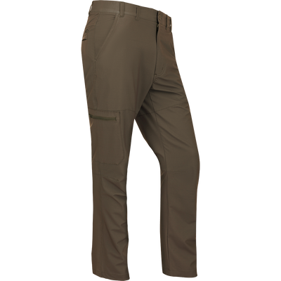 A pair of lightweight, quick-drying Traveler Trek Pants with built-in stretch for comfort. Features include articulated knees, multiple pockets, and a silicone grip waistband. Perfect for your next adventure.