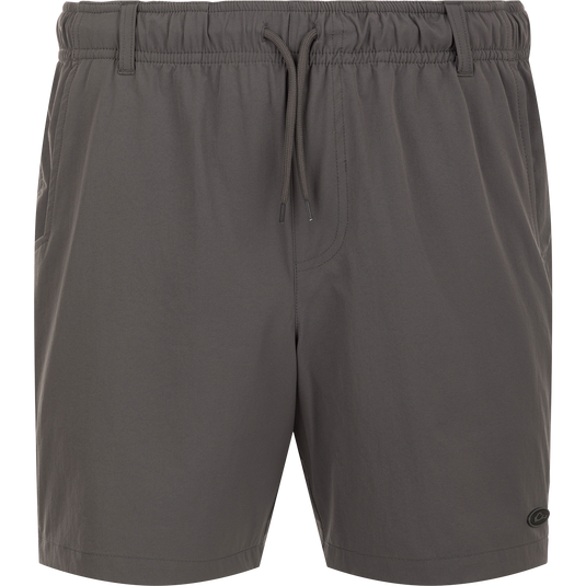 Dock Short 6" - A grey shorts with a string, made from durable 90% Nylon/10% Spandex fabric. Features quick-drying, water-resistant Nano-Tex DWR finish. Elastic waist with 5 belt loops and external drawstring for a perfect fit. Includes front slash mesh pockets, back YKK zippered mesh pockets, and a bonus pliers' pocket. Perfect for boat to dock transitions.