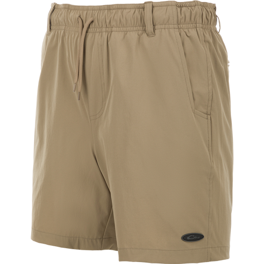 Dock Short 6" - A tan trouser made of durable 90% Nylon/10% Spandex fabric. Features include quick-drying, water-resistant Nano-Tex DWR finish, elastic waist with 5 belt loops, and an external drawstring. Includes front and back mesh-lined pockets, plus a bonus pliers pocket. Perfect for boat to dock transitions.