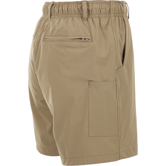 Dock Short 6" - Tan shorts with pocket and zipper detail. Made from durable 90% Nylon/10% Spandex fabric. Water resistant and quick drying. Perfect for outdoor activities.