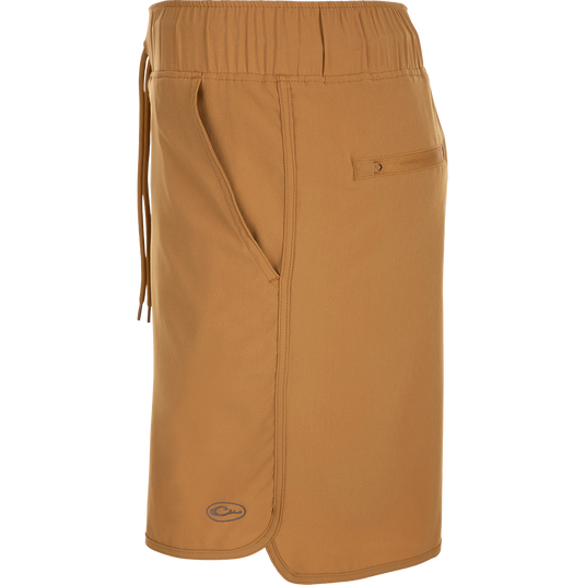 A brown Commando Lined Volley Short 7" with a pocket and logo on the surface.