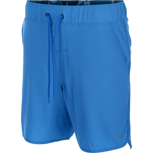 Commando Lined Volley Short 7" - A versatile blue shorts with drawstring, scalloped hem, and hidden zipper pockets. Built-in liner for quick-drying comfort.