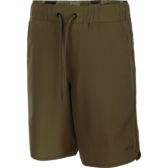 A pair of Commando Lined Volley Shorts with drawstring, scalloped hem, and hidden zipper pockets. Versatile and quick-drying, perfect for beach to bar.