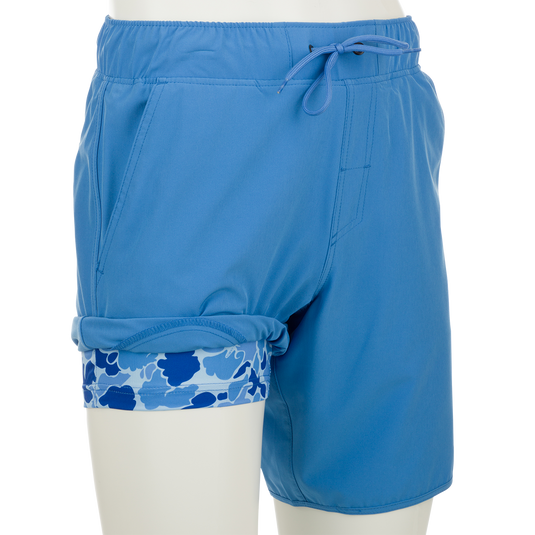 A versatile Commando Lined Volley Short 9" with a blue camo print and built-in liner, perfect for beach to bar transitions.