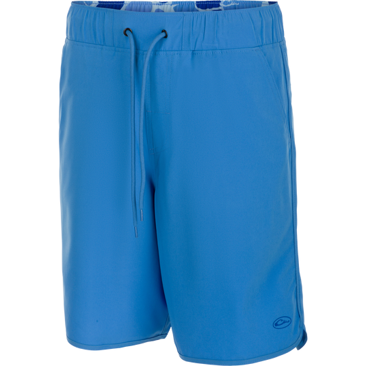 A versatile Commando Lined Volley Short 9" with built-in liner. Features quick-drying fabric, 4-way stretch, and adjustable waistband. Includes front and back pockets with hidden zippers. Perfect for beach to bar.
