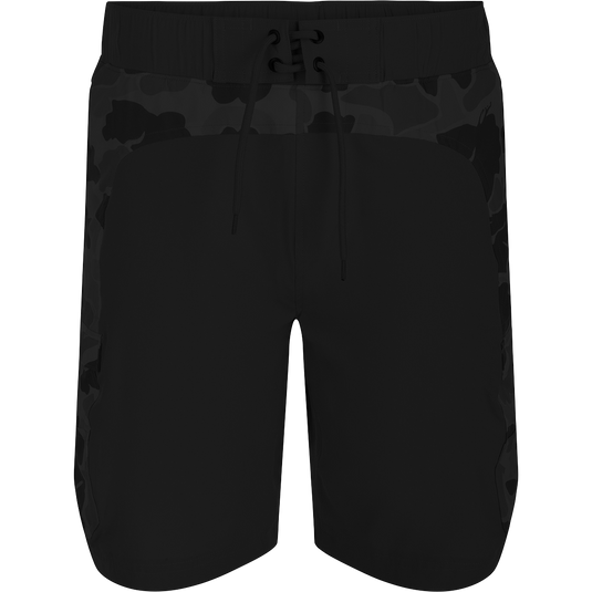 Commando Lined Board Short 9" - A versatile black shorts with camouflage pattern, 4-way stretch, quick-drying fabric, and built-in liner. Dual cargo pockets, front slash pockets, and adjustable drawstring for the perfect fit. Perfect for beach to bar transitions.