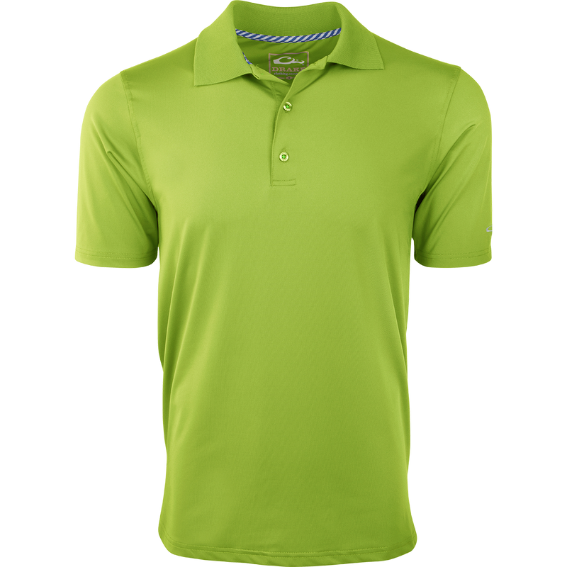 A close-up of the Performance Stretch Polo, a high-performance green shirt made of 92% polyester and 8% spandex. Moisture-wicking and four-way stretch fabric for the outdoorsman.