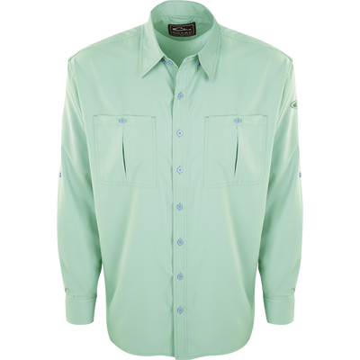 A close-up of the Flyweight Shirt with Vented Back L/S, featuring a green button-up design, collar, and sleeve. Made of ultra-lightweight polyester, it offers quick-drying, moisture-wicking, and breathable properties. With Sol-Shield™ UPF 50+ sun protection, vented mesh back, and horizontal chest pockets, it's perfect for warm-weather outdoor activities.