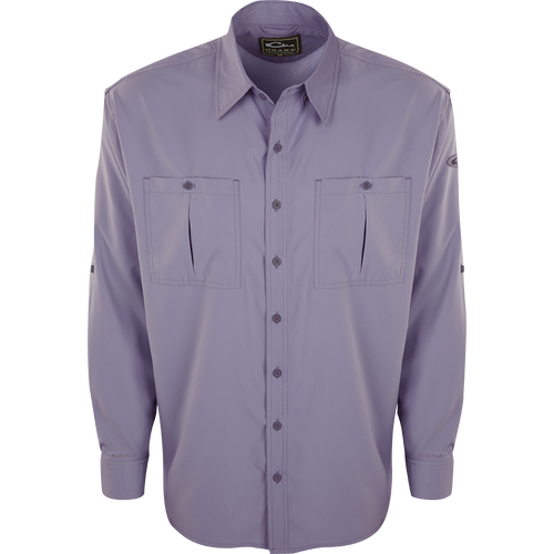 A close-up of the Flyweight Shirt with Vented Back L/S. A long-sleeved purple shirt featuring a logo and pocket. Lightweight, breathable, and quick-drying. Perfect for warm-weather outdoor activities.