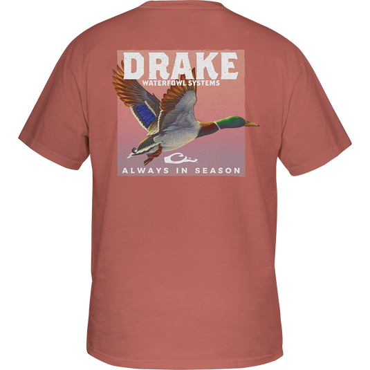 A youth Mallard In Flight T-Shirt featuring a back graphic of a duck flying in the air. Drake logo on the front. Lightweight and comfortable 60% cotton/40% polyester blend. No front pocket.