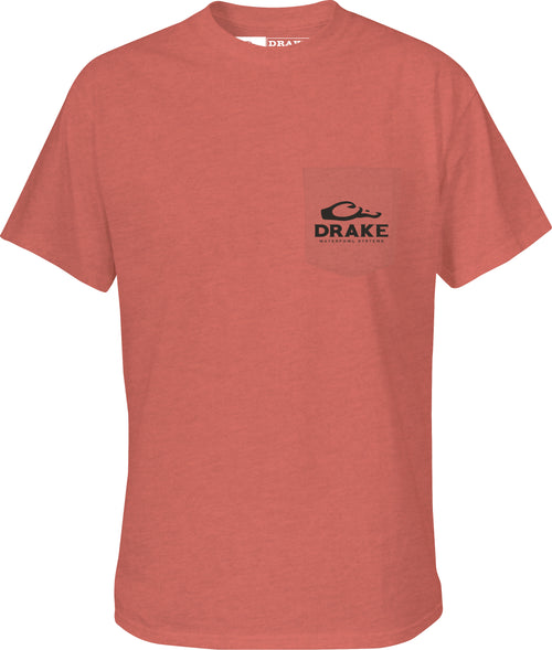 A red shirt with a pocket featuring the Drake Waterfowl logo.