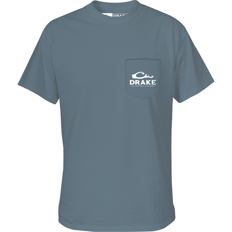 A grey t-shirt with a pocket featuring the Drake Waterfowl logo and an American Flag with the Drake Logo overprint on the back.