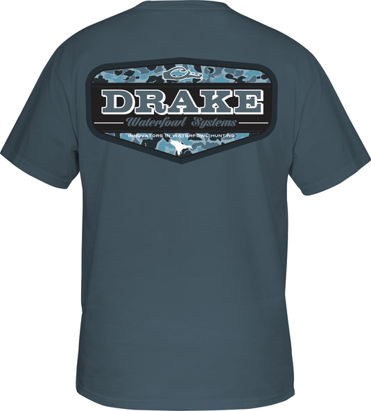 Old School Badge T-Shirt: Drake logo on front pocket, back graphic tee with waterfowl system logo. Soft, comfortable blend of cotton and polyester. Lightweight at 180 GSM. Final sale item.