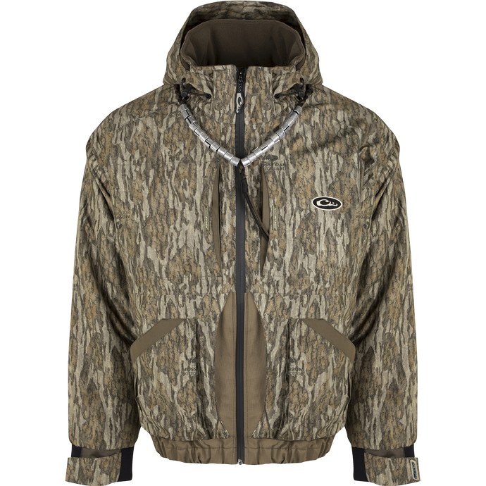 A versatile and protective Refuge™ 3.0 3-in-1 Jacket for hunters. Includes a zip-in liner with Eqwader technology for flexibility and customization. Waterproof, windproof, and breathable fabric with reinforced seams and Fowl-Proof™ YKK zippers. Features multiple pockets and a removable hood. Compatible with all Hybrid Liners.