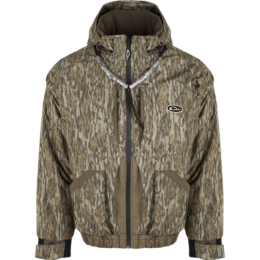 A versatile and protective Refuge™ 3.0 3-in-1 Jacket for hunters. Includes a zip-in liner with Eqwader technology for flexibility and customization. Waterproof, windproof, and breathable fabric with reinforced seams and Fowl-Proof™ YKK zippers. Features multiple pockets and a removable hood. Compatible with all Hybrid Liners.